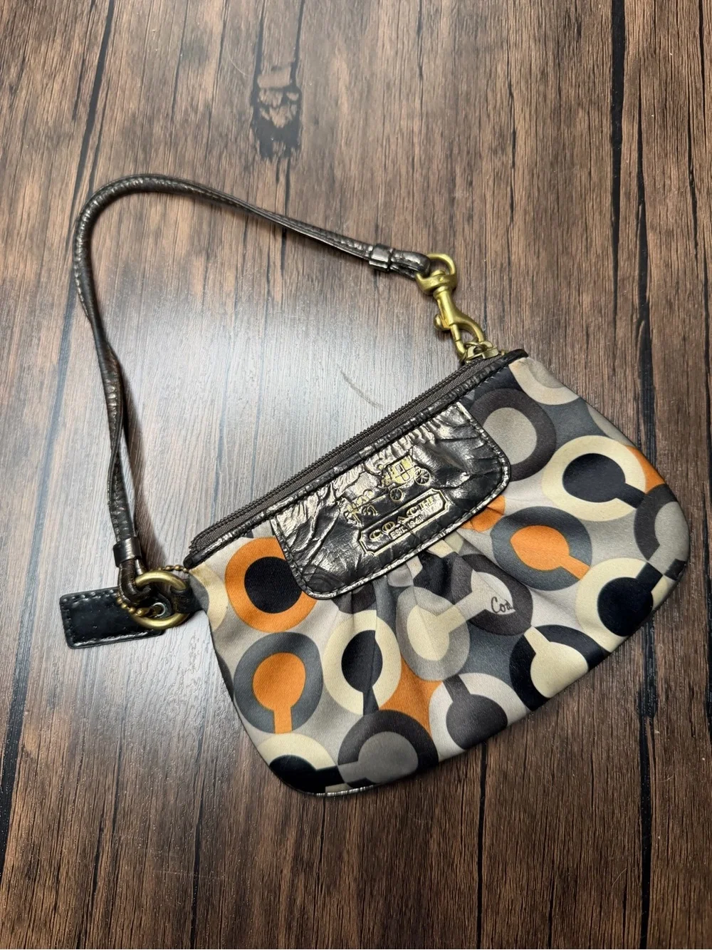 Coach Madison Graphic Op Art sateen Wristlet in Brown and Orange Accents